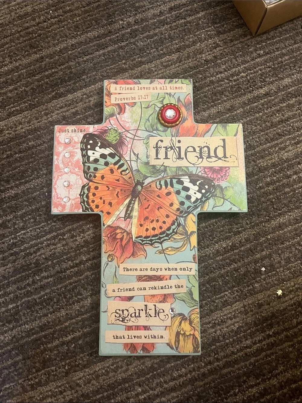 This is a wooden stand up cross with Biblical Verses about love of friends.